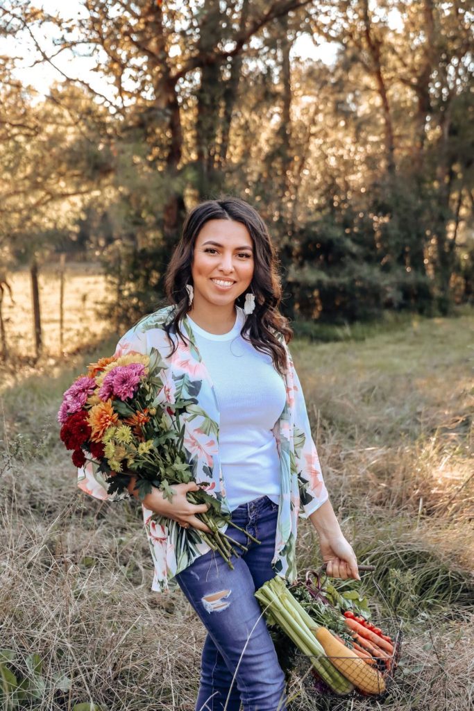 Daisy Gomez holding flowers