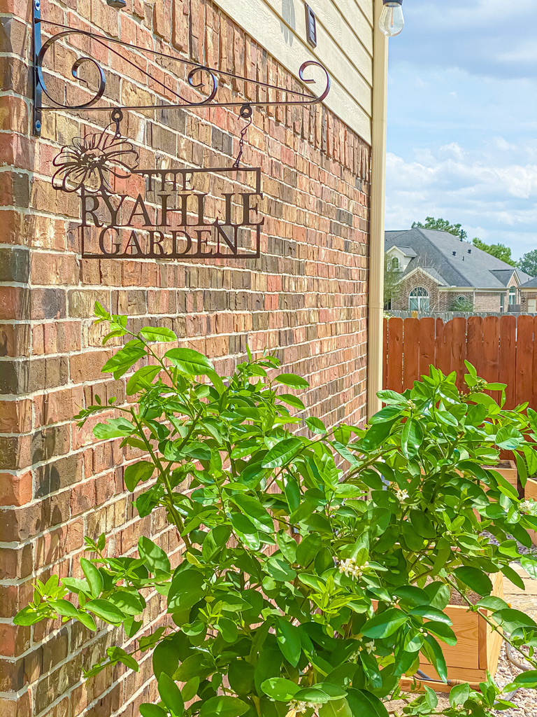 the ryahlie garden iron sign